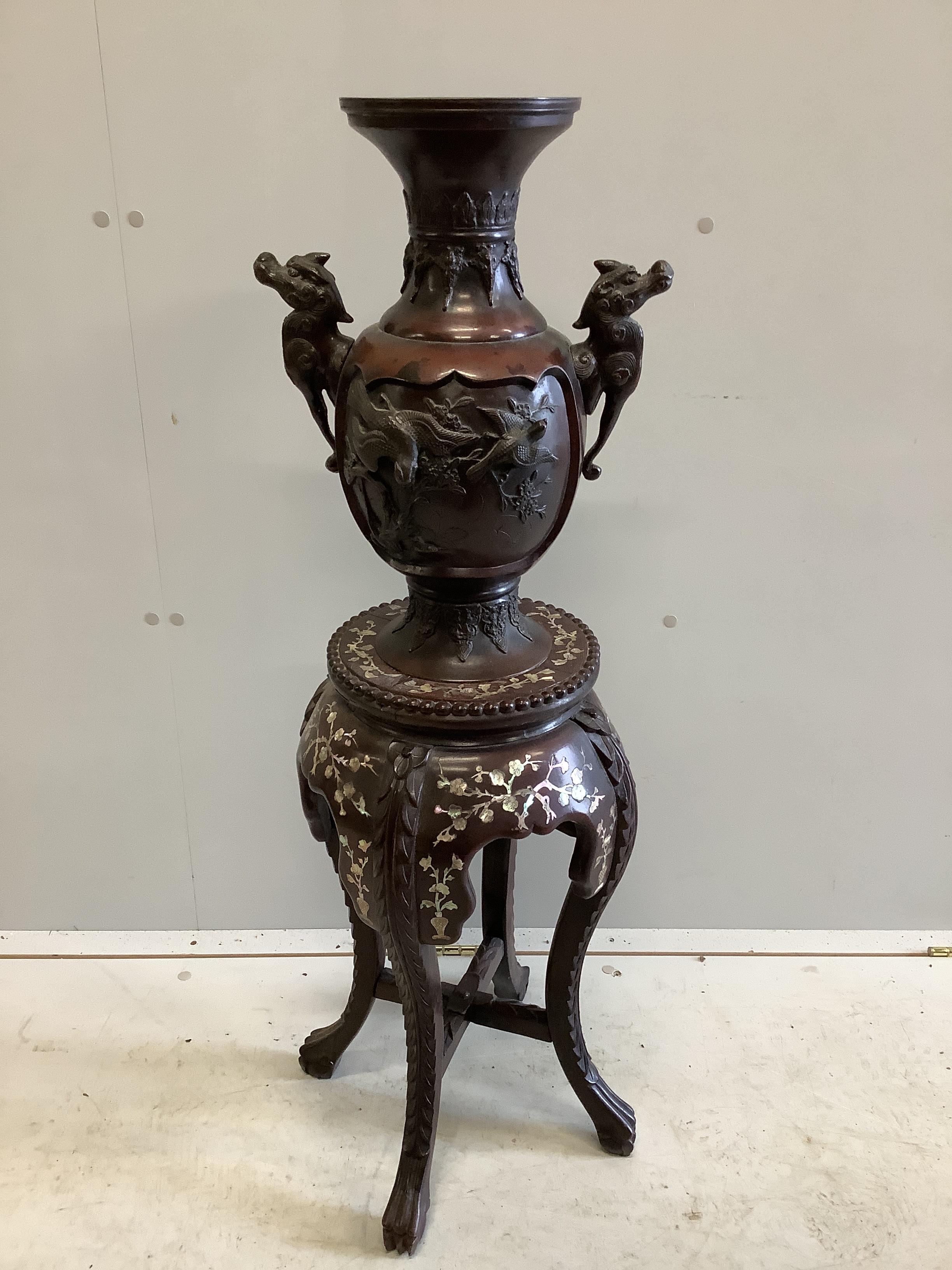 A Chinese circular marble topped vase stand, height 56cm together with a Japanese bronze two handled vase